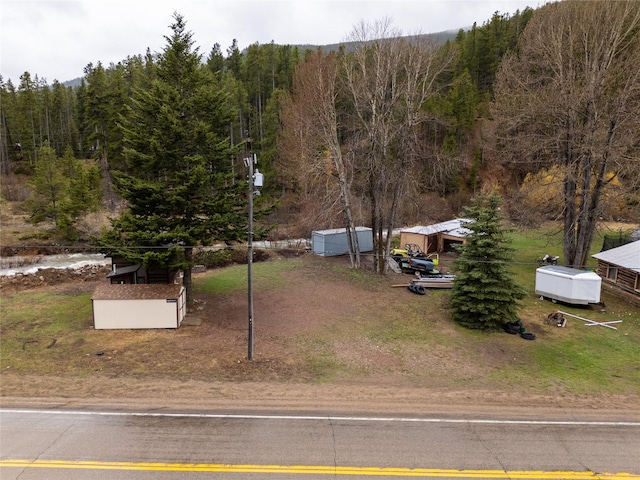 612 S Main St, Neihart, MT 59465 - manufactured / mobile home with a forest view