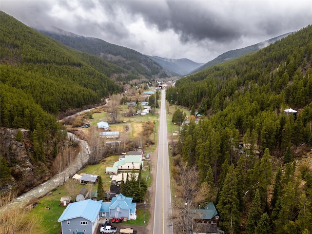 612 S Main St, Neihart, MT 59465 - view of property location featuring a mountain backdrop and a forest