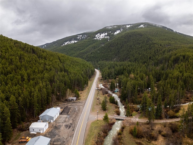 612 S Main St, Neihart, MT 59465 - aerial view of property and surrounding area with a forest and a mountain backdrop