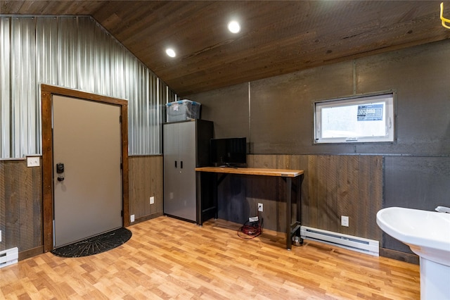 612 S Main St, Neihart, MT 59465 - basement featuring a baseboard heating unit, wood finished floors, wooden ceiling, wooden walls, and recessed lighting