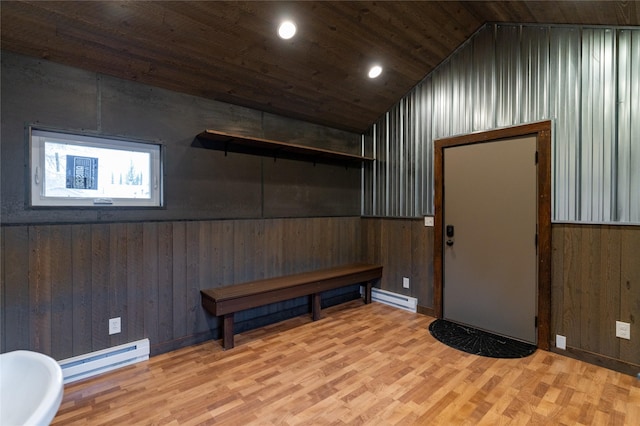 612 S Main St, Neihart, MT 59465 - basement with wood walls, wood finished floors, wood ceiling, a baseboard radiator, and recessed lighting