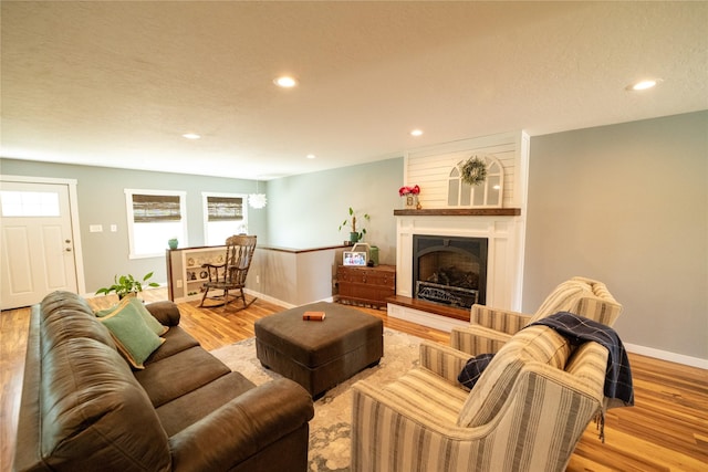 1610 Maple Dr, Fort Benton, MT 59442 - living area with wood finished floors, recessed lighting, baseboards, and a fireplace