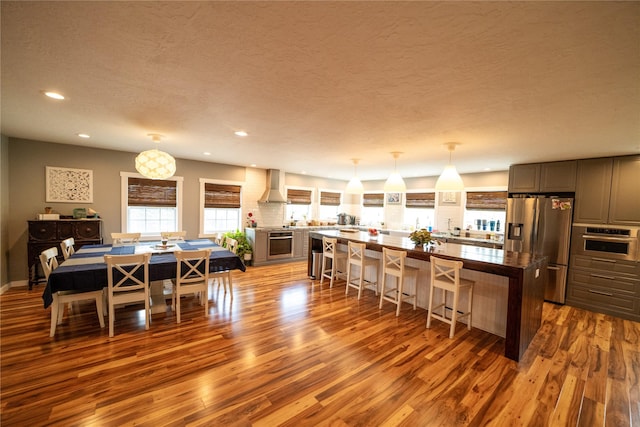 1610 Maple Dr, Fort Benton, MT 59442 - dining area with wood finished floors, plenty of natural light, recessed lighting, and a textured ceiling
