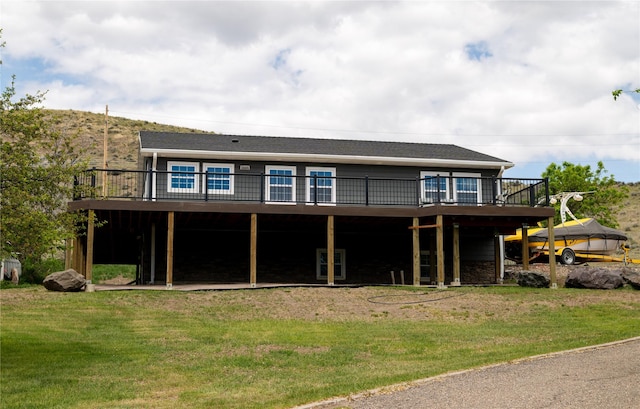 1610 Maple Dr, Fort Benton, MT 59442 - rear view of house with a wooden deck and a yard