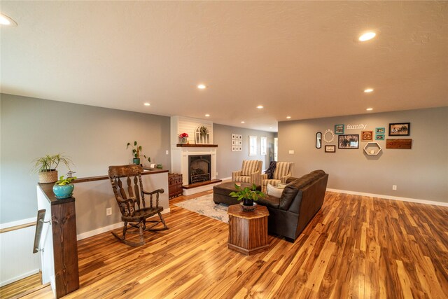 1610 Maple Dr, Fort Benton, MT 59442 - living room with light wood-type flooring, recessed lighting, and a fireplace