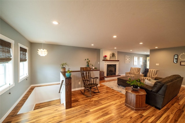 1610 Maple Dr, Fort Benton, MT 59442 - living room featuring light wood finished floors, recessed lighting, a fireplace, and baseboards