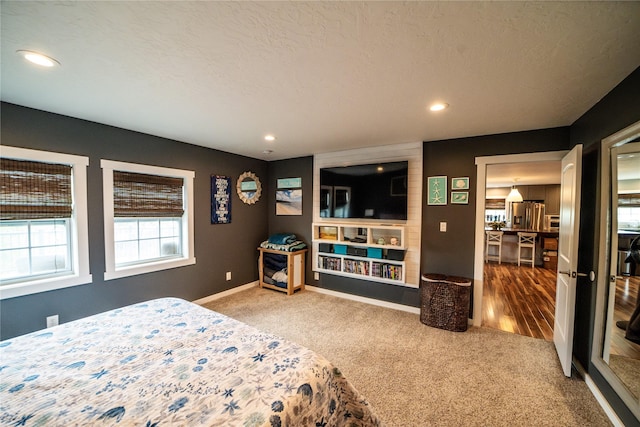 1610 Maple Dr, Fort Benton, MT 59442 - carpeted bedroom with recessed lighting, baseboards, and stainless steel fridge