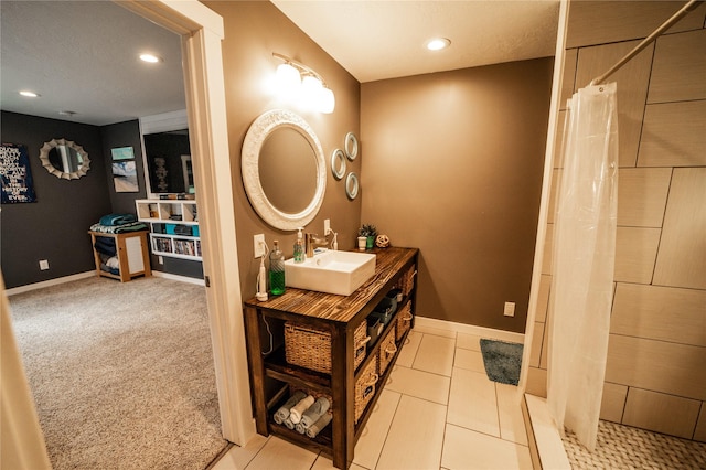 1610 Maple Dr, Fort Benton, MT 59442 - full bath with vanity, recessed lighting, a tile shower, and baseboards