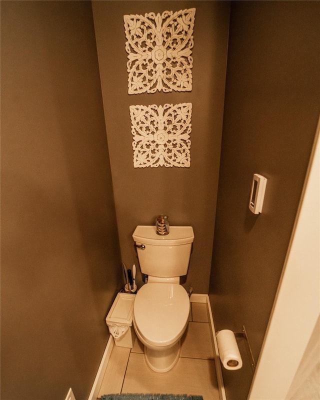 1610 Maple Dr, Fort Benton, MT 59442 - bathroom featuring baseboards, toilet, and tile patterned flooring
