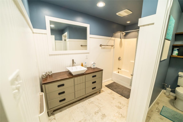 1610 Maple Dr, Fort Benton, MT 59442 - full bathroom featuring toilet, vanity, shower / tub combination, marble finish floors, and wainscoting