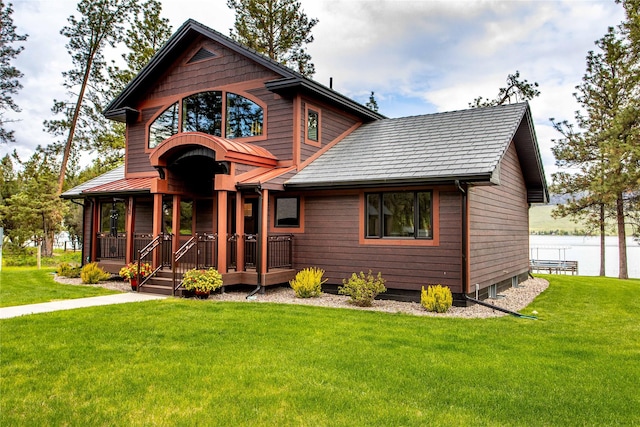 46274 Meadowlark Ln, Big Arm, MT 59910 - chalet / cabin featuring a front lawn and a water view