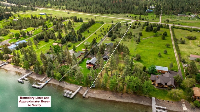 46274 Meadowlark Ln, Big Arm, MT 59910 - view of rural area with a large body of water, property parcel outlined, and a forest