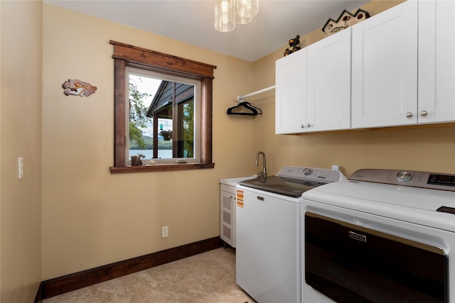 46274 Meadowlark Ln, Big Arm, MT 59910 - laundry area with cabinet space, washing machine and clothes dryer, and baseboards