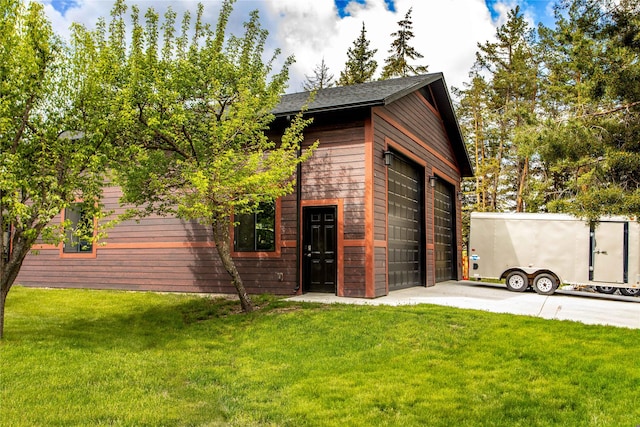 46274 Meadowlark Ln, Big Arm, MT 59910 - view of outdoor structure featuring an attached garage