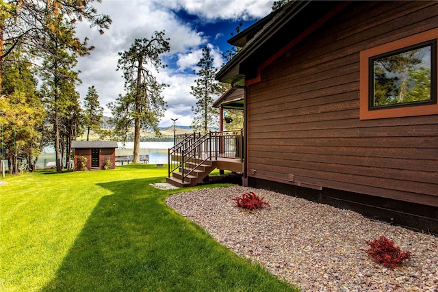 46274 Meadowlark Ln, Big Arm, MT 59910 - view of green lawn featuring an outbuilding