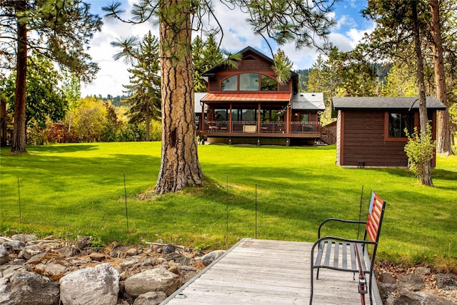 46274 Meadowlark Ln, Big Arm, MT 59910 - view of grassy yard with a deck