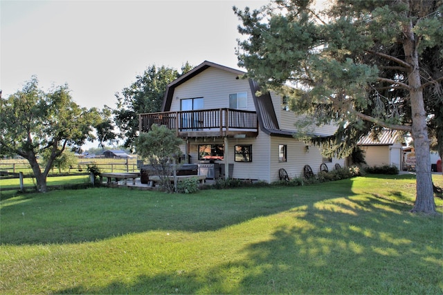 34575 Gunlock Rd, Charlo, MT 59824 - back of house featuring a gambrel roof and a deck