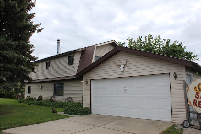 34575 Gunlock Rd, Charlo, MT 59824 - view of front of house featuring a front lawn, driveway, and an attached garage