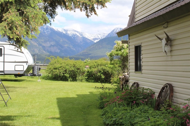 34575 Gunlock Rd, Charlo, MT 59824 - view of green lawn featuring a mountain view