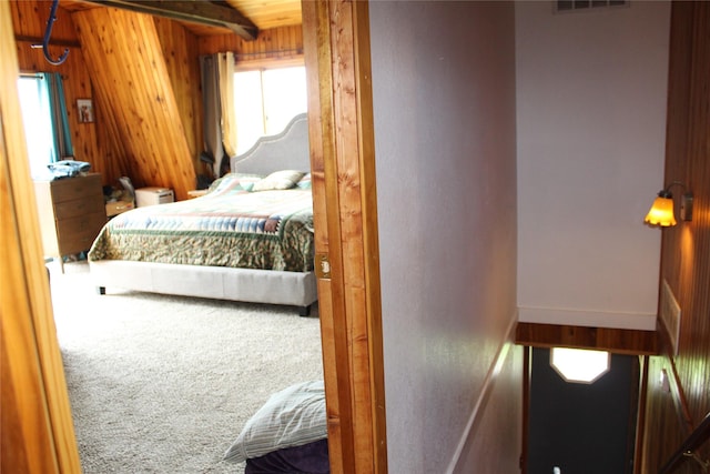 34575 Gunlock Rd, Charlo, MT 59824 - bedroom with carpet floors and wooden walls