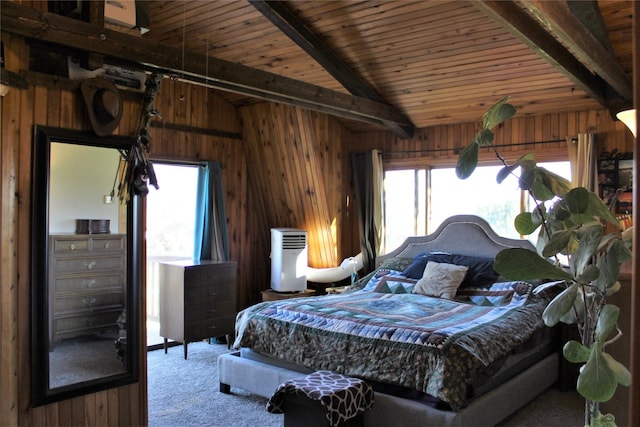 34575 Gunlock Rd, Charlo, MT 59824 - carpeted bedroom with wood walls, multiple windows, and wooden ceiling