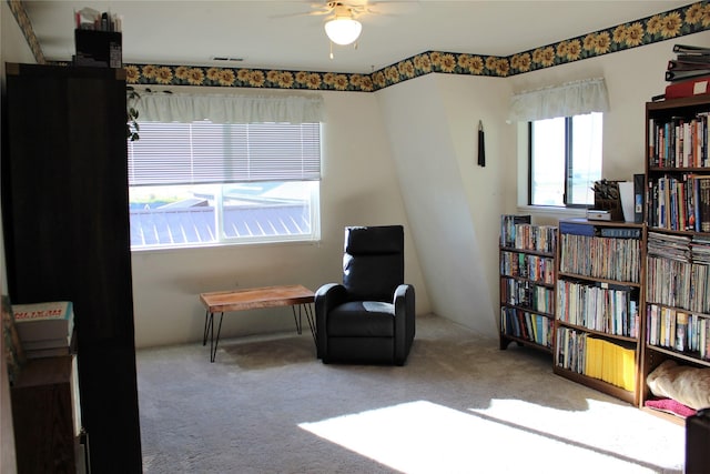 34575 Gunlock Rd, Charlo, MT 59824 - living area with carpet flooring and a ceiling fan