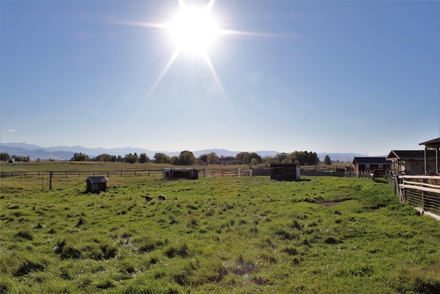 34575 Gunlock Rd, Charlo, MT 59824 - view of yard featuring a rural view, a mountain view, and an exterior structure