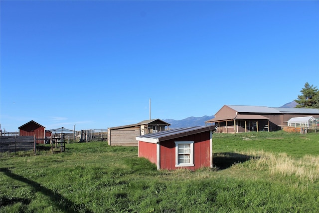 34575 Gunlock Rd, Charlo, MT 59824 - view of yard featuring an outdoor structure and a mountain view