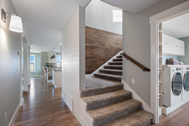 1221 Majestic View Ln, Kalispell, MT 59901 - staircase featuring washer and dryer, wood finished floors, and baseboards