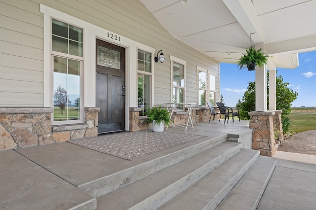 1221 Majestic View Ln, Kalispell, MT 59901 - view of exterior entry featuring a porch and stone siding