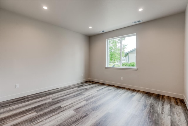 1050 Mill Creek Dr, Bigfork, MT 59911 - empty room featuring wood finished floors, baseboards, and recessed lighting