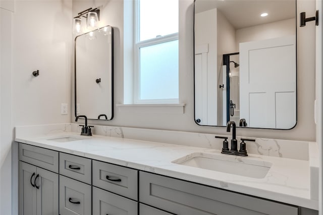 1050 Mill Creek Dr, Bigfork, MT 59911 - bathroom featuring double vanity and plenty of natural light