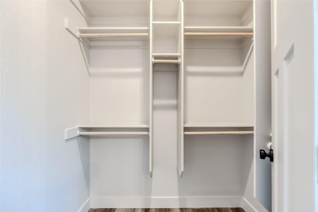 1050 Mill Creek Dr, Bigfork, MT 59911 - walk in closet with wood finished floors