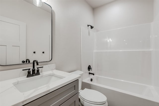1050 Mill Creek Dr, Bigfork, MT 59911 - bathroom featuring toilet, vanity, and shower / washtub combination