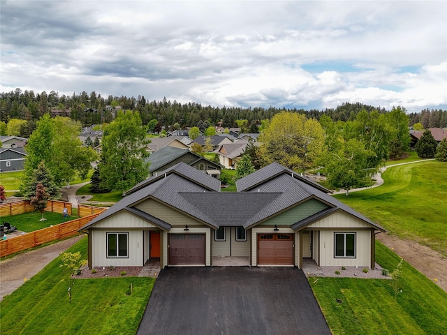 1050 Mill Creek Dr, Bigfork, MT 59911 - view of front of home with a garage and asphalt driveway