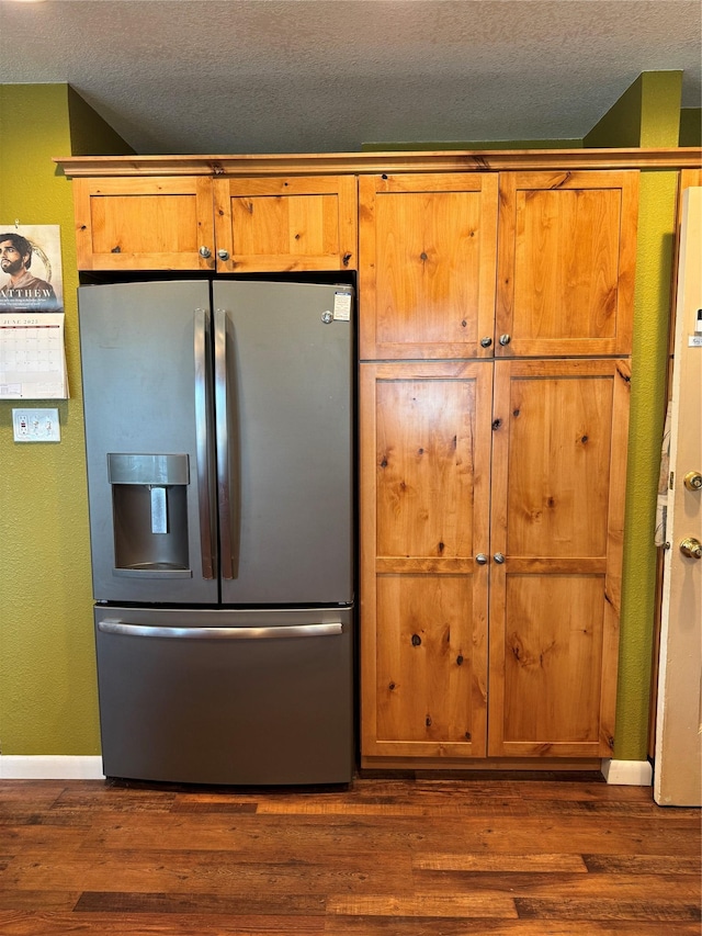 3115 8th Ave N, Great Falls, MT 59401 - kitchen featuring stainless steel refrigerator with ice dispenser, a textured ceiling, dark wood-type flooring, and brown cabinetry