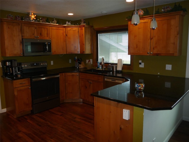 3115 8th Ave N, Great Falls, MT 59401 - kitchen with stainless steel microwave, electric range oven, a sink, a peninsula, and dark wood-style floors