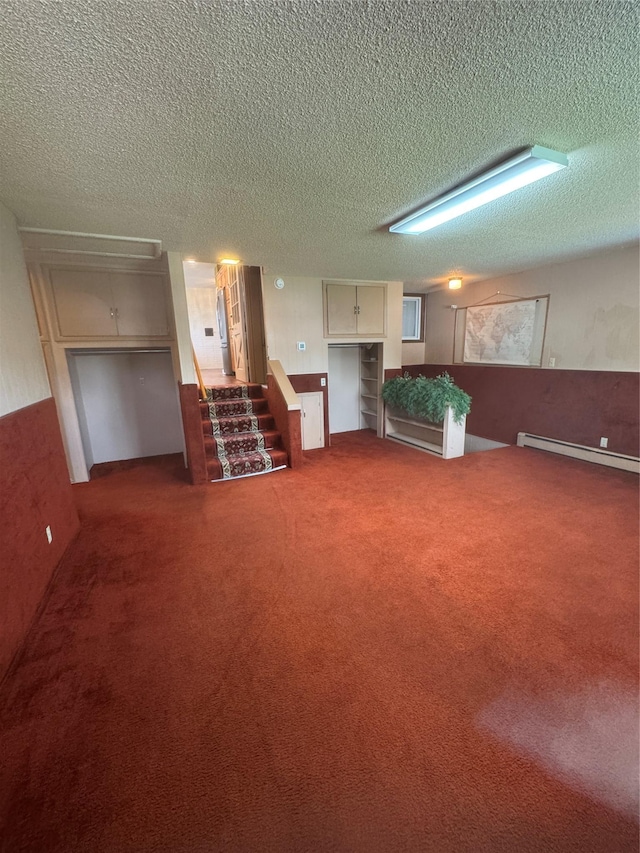 3115 8th Ave N, Great Falls, MT 59401 - carpeted living area featuring a baseboard radiator, a textured ceiling, and stairs