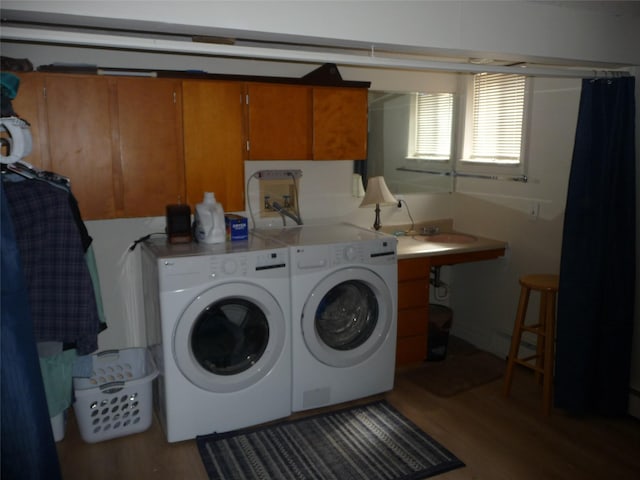 3115 8th Ave N, Great Falls, MT 59401 - laundry room featuring cabinet space, wood finished floors, and washer and dryer