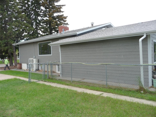 3115 8th Ave N, Great Falls, MT 59401 - view of property exterior with a chimney, a gate, and a shingled roof