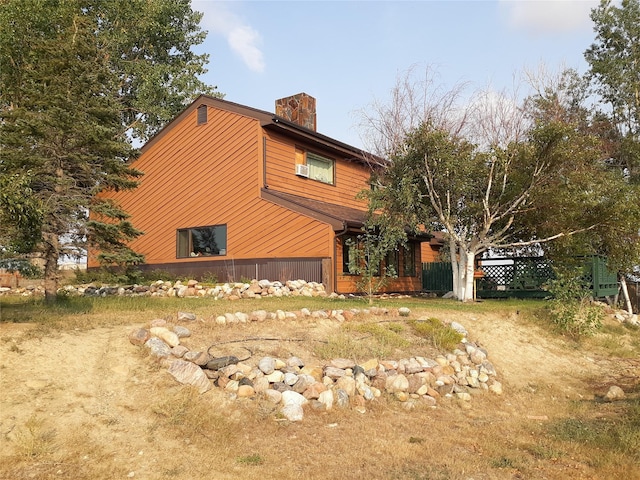 314 4th Ave NE, Cut Bank, MT 59427 - view of property exterior with a chimney