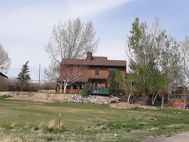314 4th Ave NE, Cut Bank, MT 59427 - back of property with a chimney and a yard