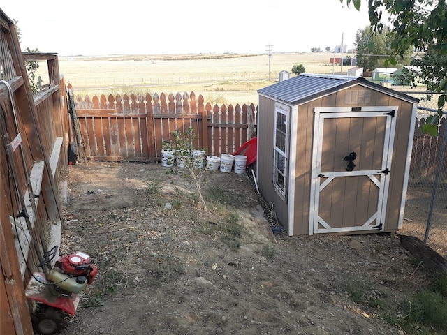 314 4th Ave NE, Cut Bank, MT 59427 - view of shed featuring a fenced backyard and a rural view