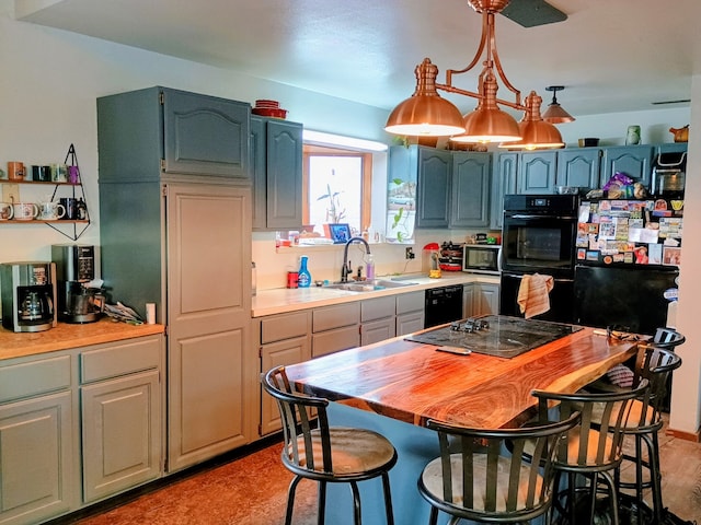 314 4th Ave NE, Cut Bank, MT 59427 - kitchen with a sink, black appliances, a kitchen breakfast bar, and pendant lighting