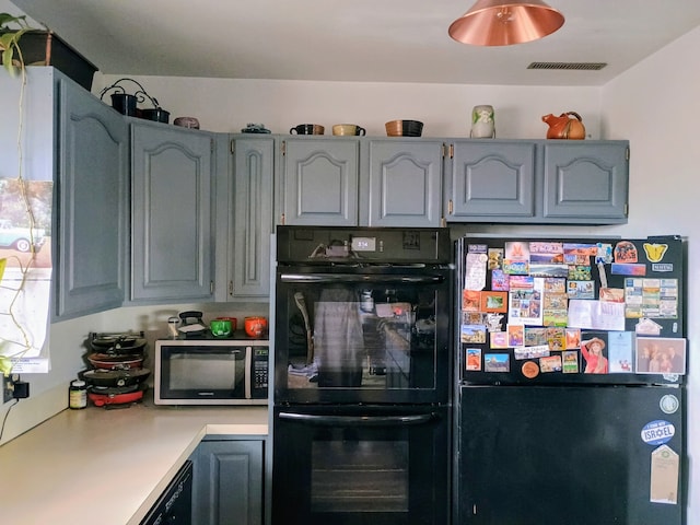 314 4th Ave NE, Cut Bank, MT 59427 - kitchen featuring black appliances and light countertops