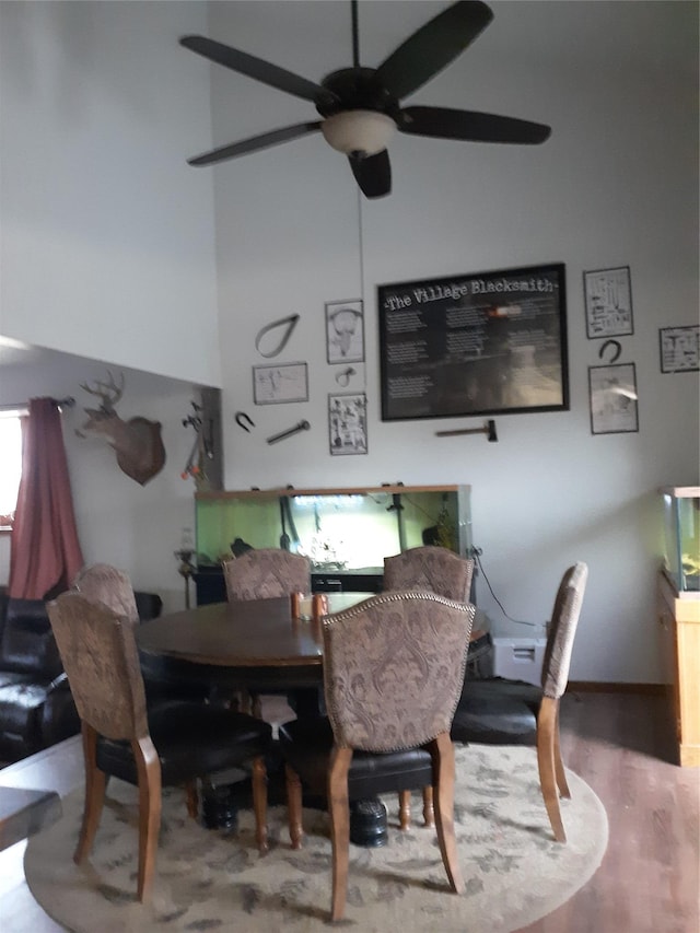 314 4th Ave NE, Cut Bank, MT 59427 - dining room featuring ceiling fan, wood finished floors, and a towering ceiling