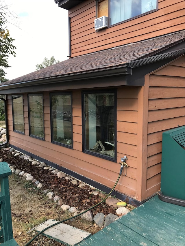 314 4th Ave NE, Cut Bank, MT 59427 - view of home's exterior featuring roof with shingles and cooling unit