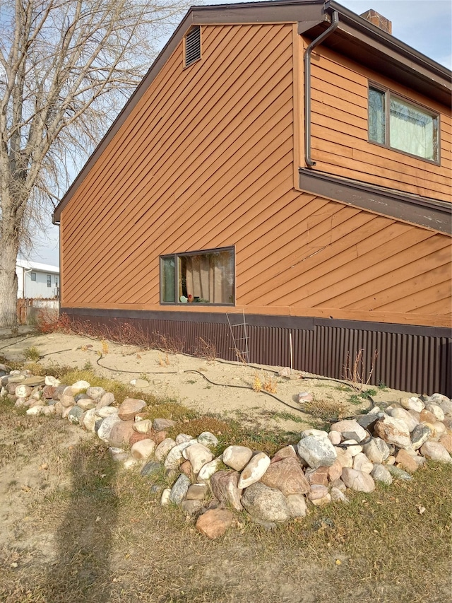 314 4th Ave NE, Cut Bank, MT 59427 - view of home's exterior featuring a chimney