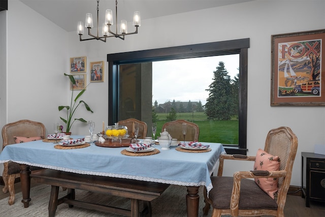 344 Chapman Ln, Bigfork, MT 59911 - dining room featuring a chandelier and wood finished floors