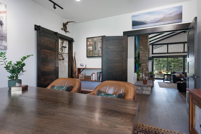 344 Chapman Ln, Bigfork, MT 59911 - home office featuring a barn door and hardwood / wood-style floors